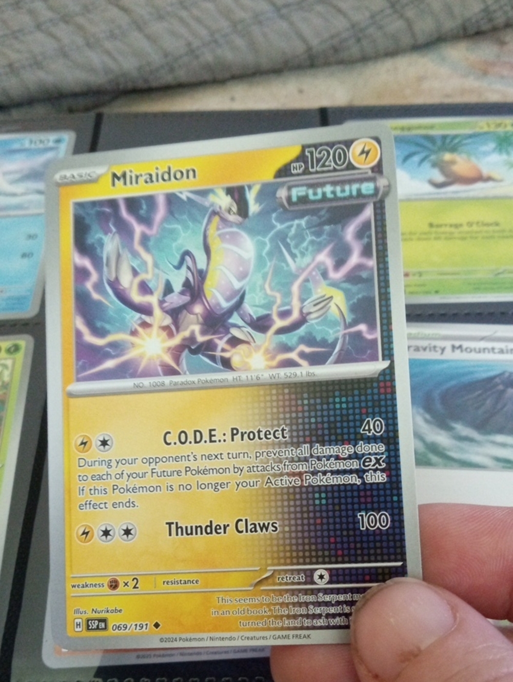 Pokemon Miraidon Trading Card - Yellow and Purple Accents